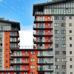 Apartment - Gray, Red, and Orange Concrete Building