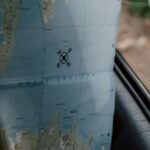 Itinerary - Person in Plaid Long Sleeve Shirt Holding a Map