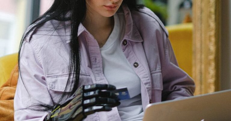 Laptop - A Woman Sitting on the Couch