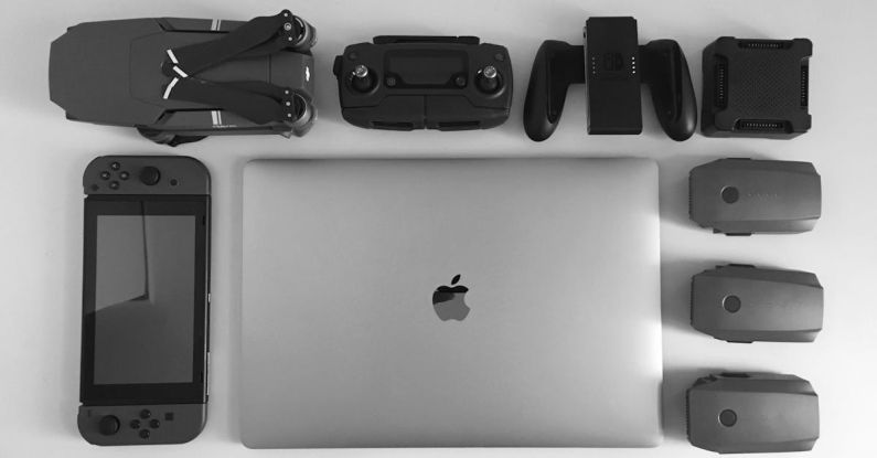 Gadgets - Silver Macbook Surrounding Black Electronic Devices