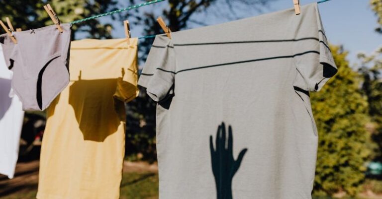 Clothes - Clothes drying on rope with clothespins in garden