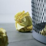 Ideas - Focus Photo of Yellow Paper Near Trash Can