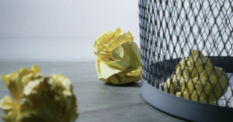 Ideas - Focus Photo of Yellow Paper Near Trash Can